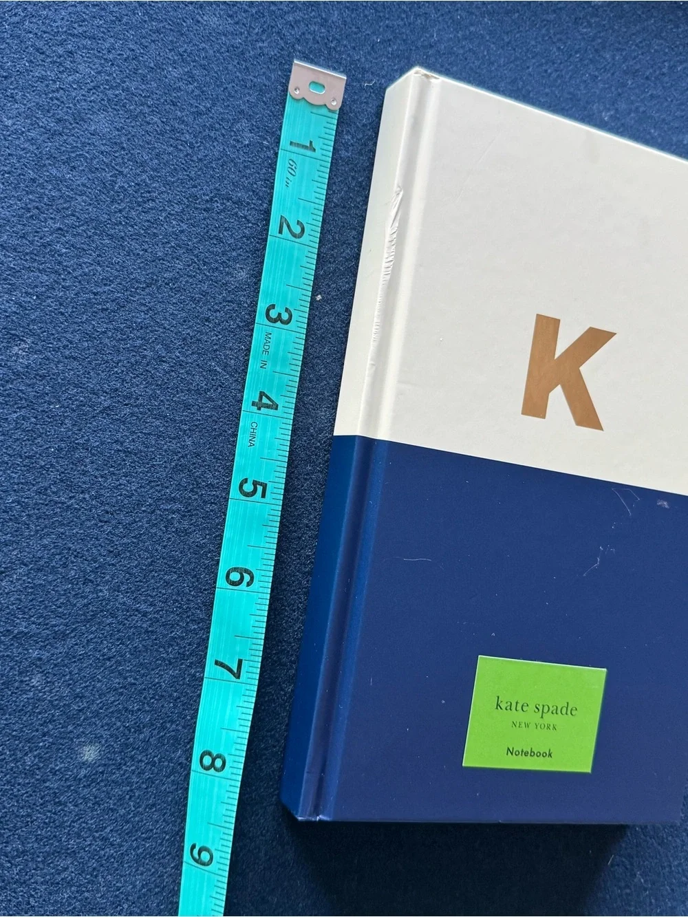 kate spade ♠️ cream, and purple lined Notebook with coordinating ribbon marker